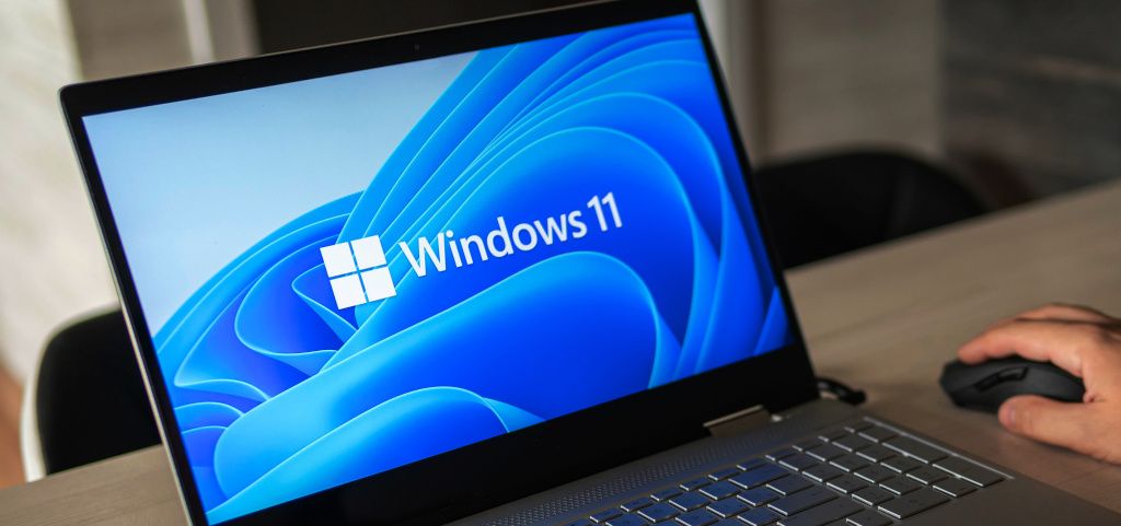 Person using laptop with Windows 11 Operating System